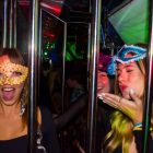 Cute masked girls in cage Barcelona bus party